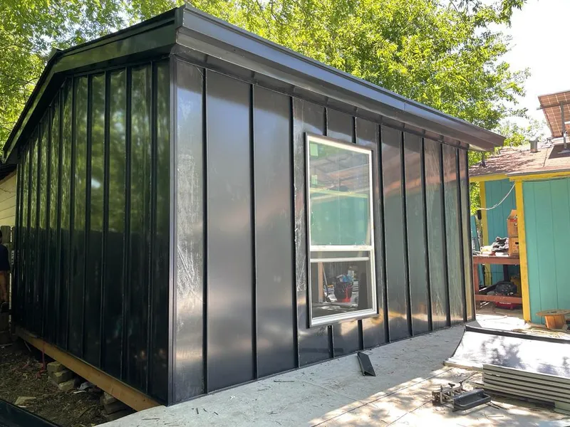 Black standing seam metal wall panels for Roof Inspection in El Reno