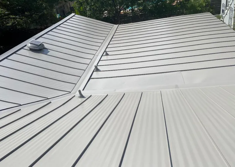 Solar attic fan installed on a metal roof for Roof Ventilation in El Reno